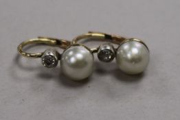 A pair of yellow metal, cultured pearl and diamond earrings.