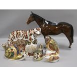 Six Royal Crown Derby paperweights and a Beswick bay horse, the paperweights to include a Bengal