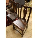 Three mid 18th century oak dining chairs and a box