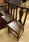 Three mid 18th century oak dining chairs and a box