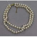 A double strand cultured pearl choker necklace, with yellow metal rectangular clasp, 38cm.