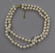A double strand cultured pearl choker necklace, with yellow metal rectangular clasp, 38cm.