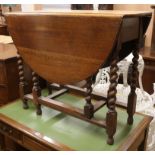 An oak gateleg table W.92cm