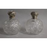 A pair of late Victorian silver mounted cut glass scent bottles, Chester, 1900, 13.5cm.