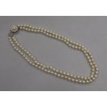 A double strand cultured pearl necklace, with a 9ct gold and cultured pearl clasp, 50cm.