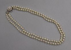 A double strand cultured pearl necklace, with a 9ct gold and cultured pearl clasp, 50cm.
