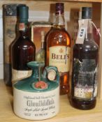 Six bottles of whisky: Glenmorangie, Glenfiddich Still Master's Crock, Wine Society Islay, Bells