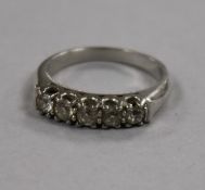 A white metal and five stone diamond ring, size M.