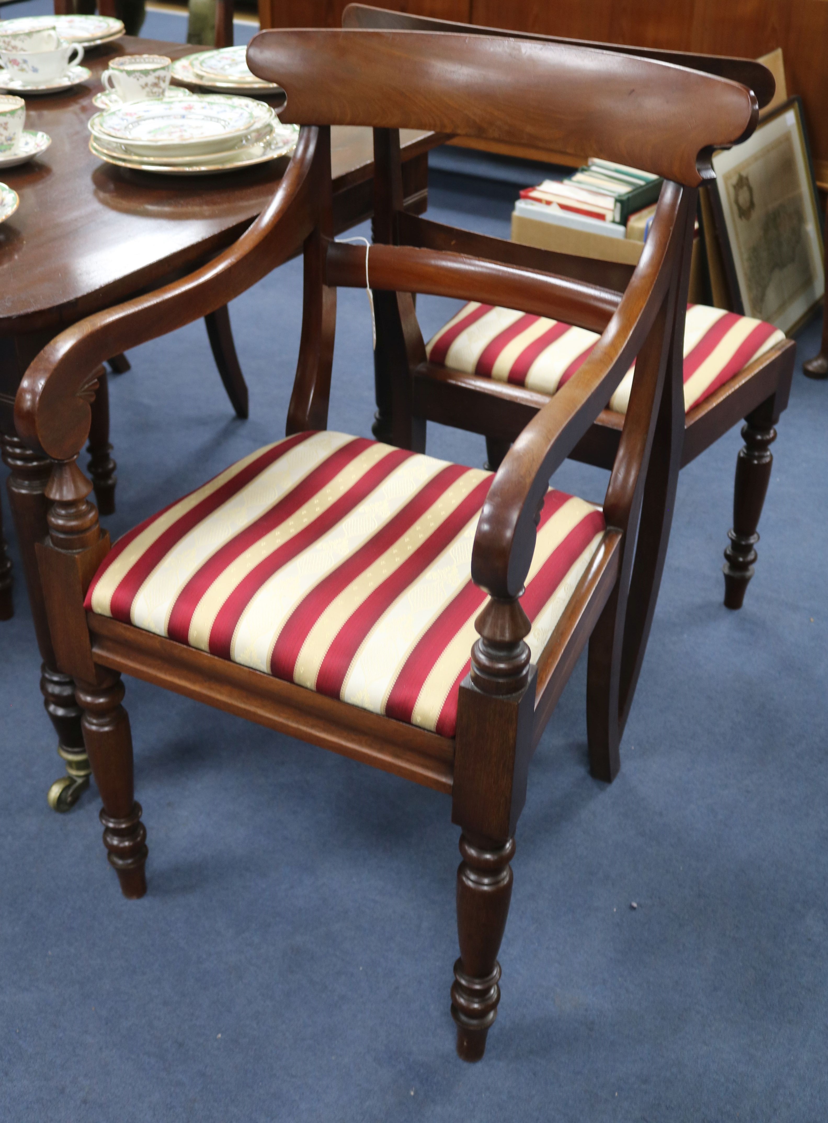 A set of six late Georgian mahogany dining chairs, with Trafalgar seats on turned legs (two with