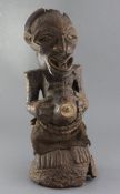 An African carved wood fertility figure, 54cm