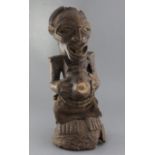 An African carved wood fertility figure, 54cm