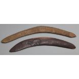 Two hardwood boomerangs, one carved with an emu, 55cm, the other a hunter and animals, 64cm