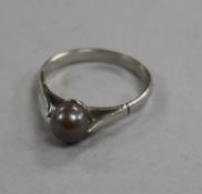 A platinum and Tahitian cultured pearl ring, size N.