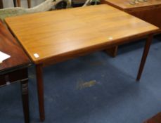 A Danish teak extending dining table by Henning Kjaernuff, c. 1970. W.140cm