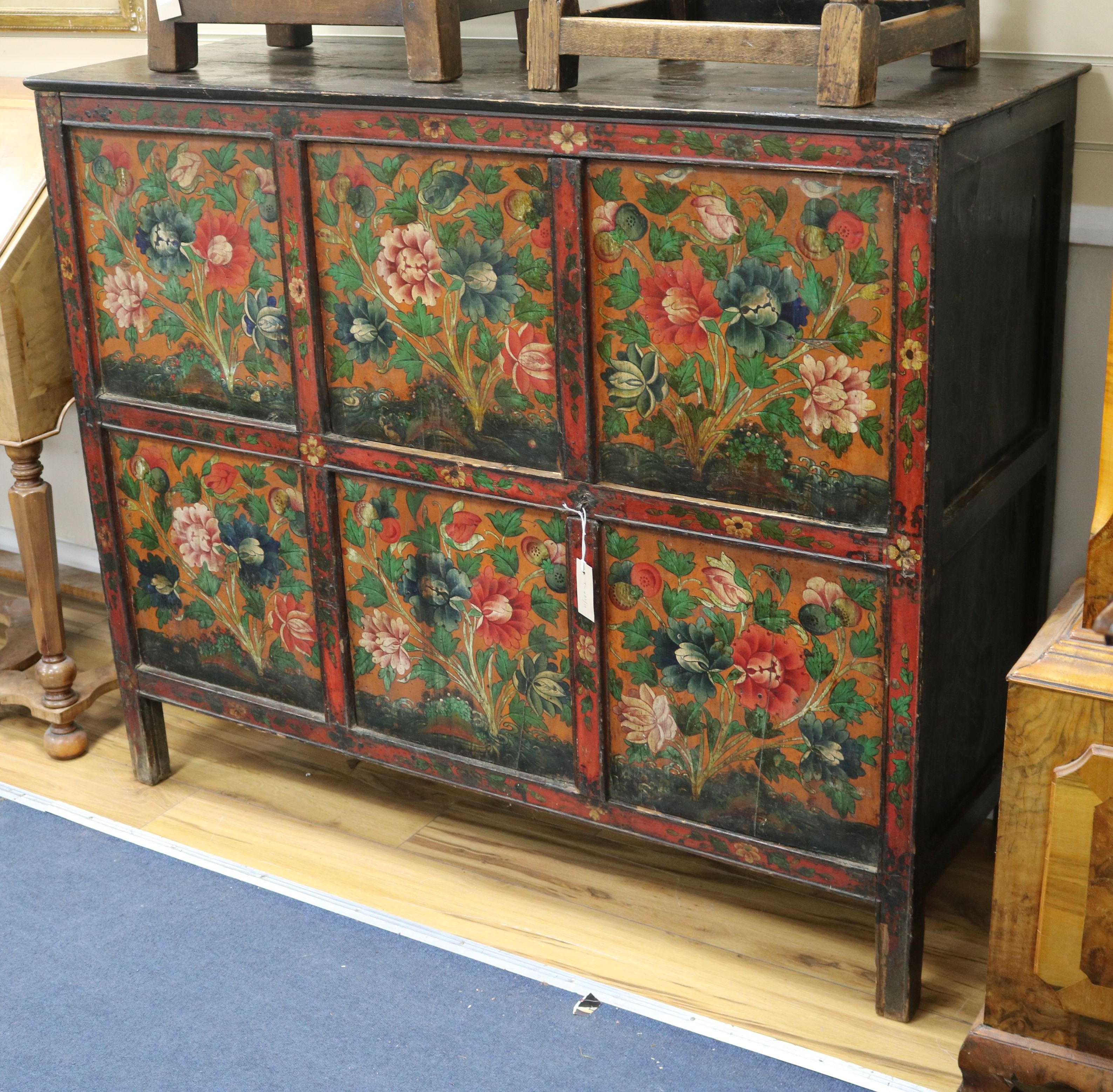 An Eastern painted and decorated pine cabinet W.127cm