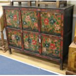 An Eastern painted and decorated pine cabinet W.127cm