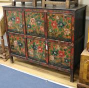An Eastern painted and decorated pine cabinet W.127cm