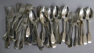 A matched part service of silver fiddle pattern flatware, crested, George IV, William IV and