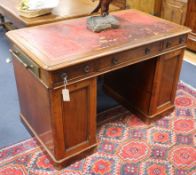 A small victorian mahogany partners desk, stamped Johnstone & Jeanes W.114cm