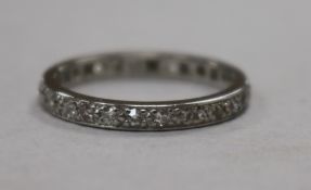 A white metal and diamond set full eternity ring, size N.