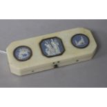 A George III ivory toothpick case, the cover inset with three gold framed Wedgwood jasper plaques,