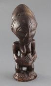 A Yoruba type carved wood figure of a woman, 29cm