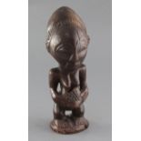 A Yoruba type carved wood figure of a woman, 29cm