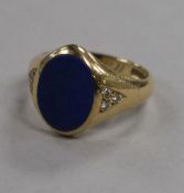 A 1980's 9ct gold, lapis lazuli and diamond set signet ring, size R.