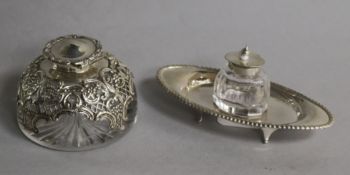An Edwardian silver mounted domed top glass inkwell, William Comyns, London, 1905 and one other