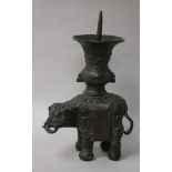 A 19th century Chinese bronze elephant pricket candlestick, damaged