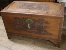 A carved camphorwood chest W.105cm