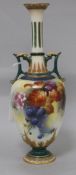 A Royal Worcester twin-handled vase, shape no. 311, painted with berries and autumn leaves, signed