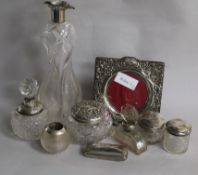 An Edwardian silver collared glass decanter by Elkington & Co and eight other items including toilet