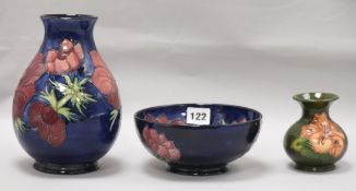 A Moorcroft Anemone pattern vase and bowl, and a Hibiscus vase tallest 19cm (3)