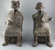 A pair of large Bamum People of Cameroon bronze figures of a seated King Mbuembe and the Queen, 56cm