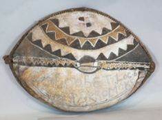 An elephant hide shield, with painted decoration and inscribed 'Robert Loc Kararromoki', 100cm