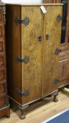 A walnut slender cocktail cabinet W.57cm