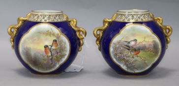 A pair of Grainger & Co Worcester two-handled vases, 1894, of globular form with reticulated rims,