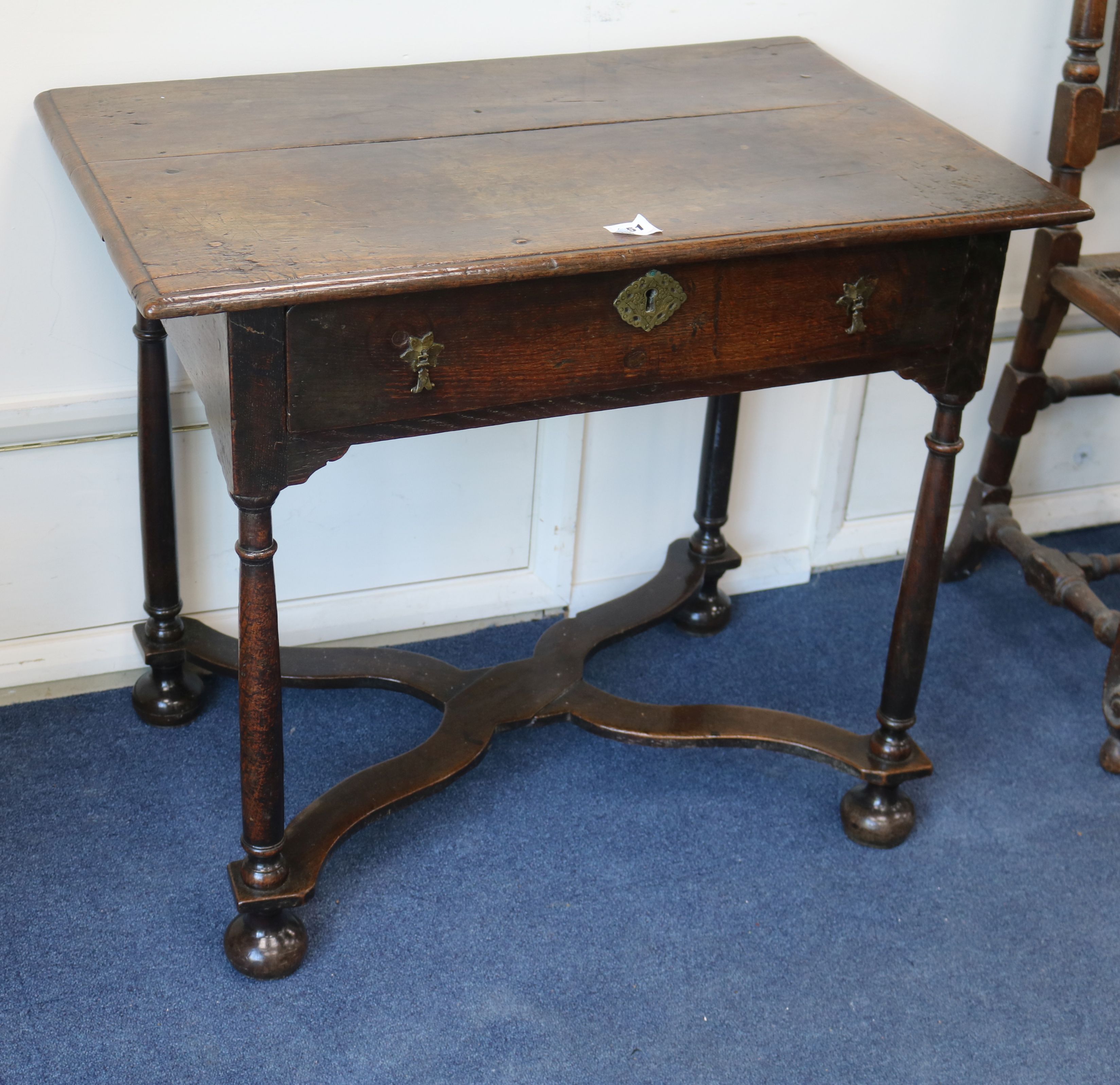 A William & Mary style oak side table, with a shaped 'X' understretcher W.84cm