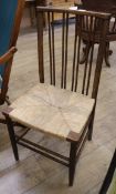 A rush seat spindle back dining chair
