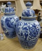 A pair of Delft vases and covers height 46cm