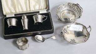 Two pierced silver sweetmeat dishes, a George III silver caddy spoon, silver three piece condiment