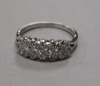 A modern 18ct white gold and diamond cluster, size M.