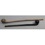 Two hardwood war clubs, one in a dark wood with a pointed knob, 58cm, the other bleached burr