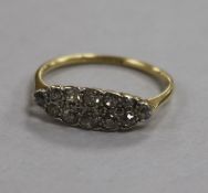 An early 20th century 18ct gold and diamond 'marquise' shaped cluster ring, size R.