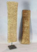 Two ribbed carved wooden shields, 114cm