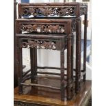 A Chinese nest of four carved hardwood tea tables (the largest a.f.) W.44cm