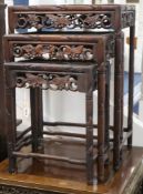 A Chinese nest of four carved hardwood tea tables (the largest a.f.) W.44cm