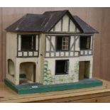 A 1920's Triang dolls house W.61cm