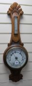 An oak aneroid barometer W.26cm